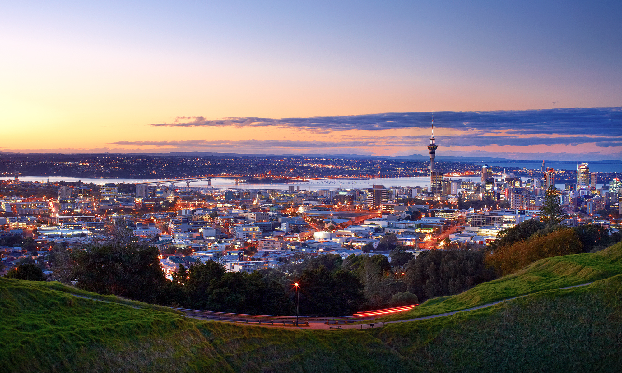 Overview of Auckland city at night, taken from to top of a mountain.